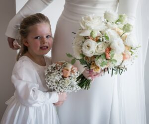 Bride and flower girl holding white bouquets flowers Melbourne wedding