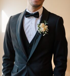 Groom wearing buttonhole flowers Melbourne wedding suit detail
