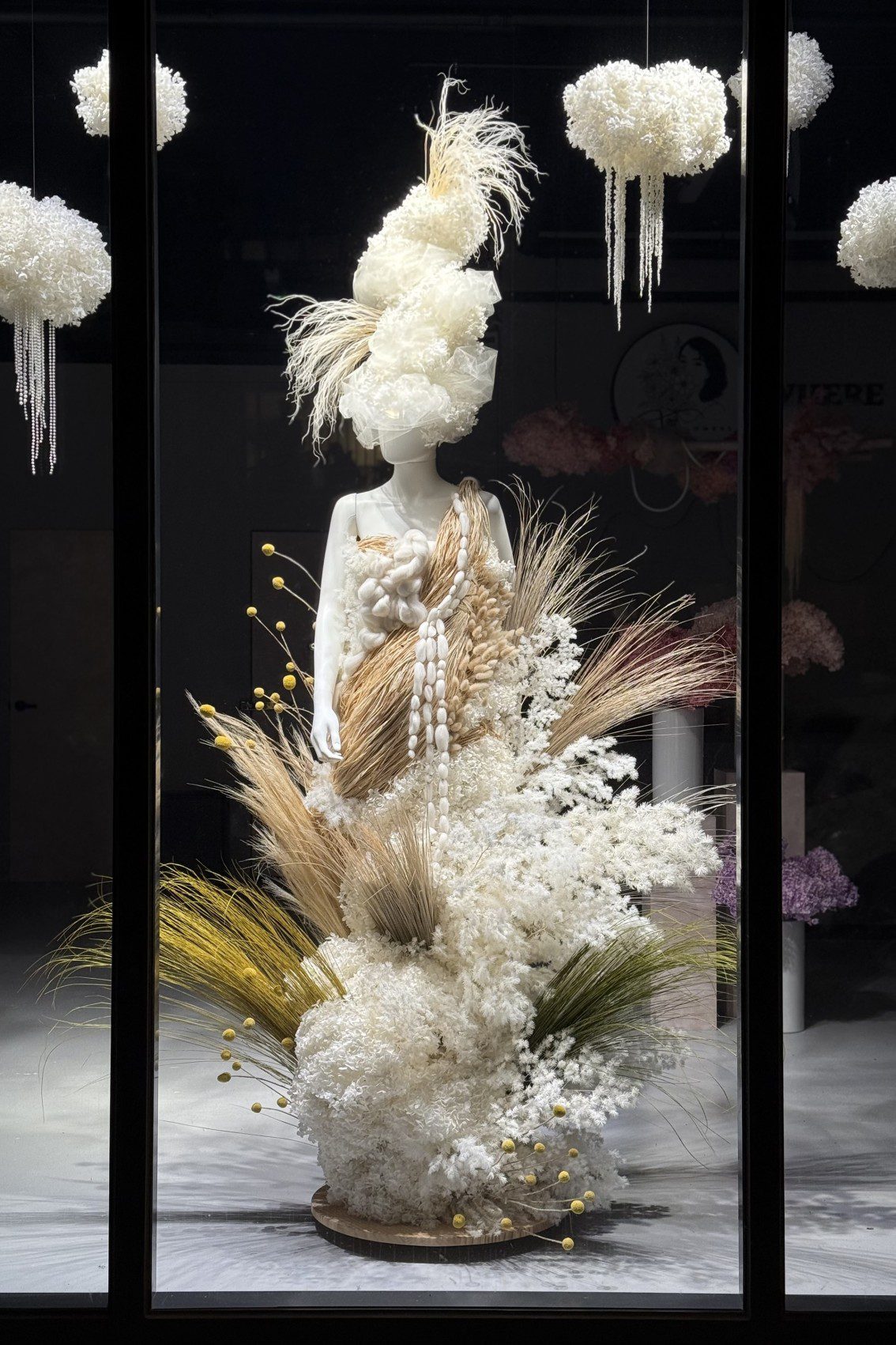 Mannequin decorated with flowers in an artistic floral installation, created by Melbourne florist Fay flowers