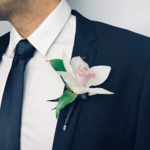 Orchid buttonhole boutonniere with fresh flowers, handcrafted by Melbourne florist Fayflower for weddings and formal events