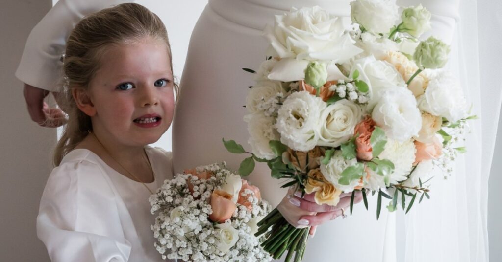 Bride and flower girl holding white bouquets flowers Melbourne wedding