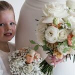 Bride and flower girl holding white bouquets flowers Melbourne wedding