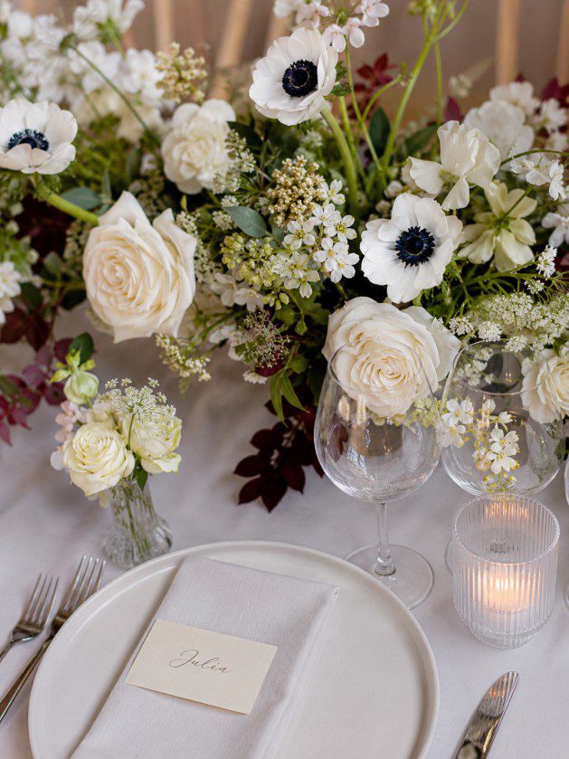 Luxury Bridal Table Flowers for Melbourne Weddings Fay Flowers Studio Elegant bridal table flowers with white and blush seasonal blooms arranged in a modern, low floral design for a luxury Melbourne wedding reception.